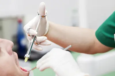 Dentist provides dental anesthesia